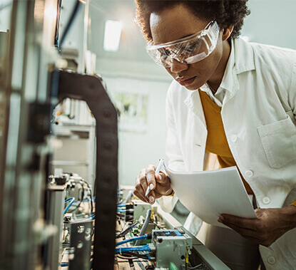 Scientist inspecting equipment
