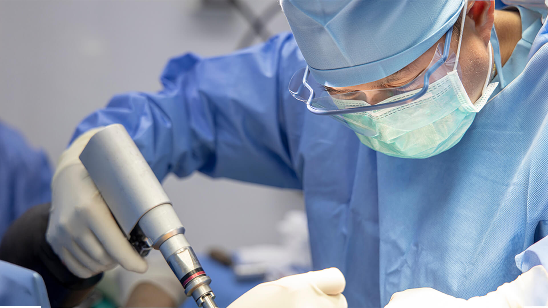 Surgeon uses a drill designed and tested based on the novel acoustic sensing approach.