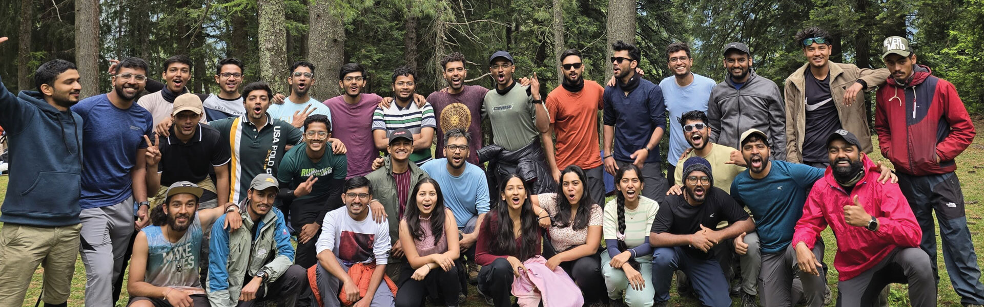 Large group of people smiling at camera
