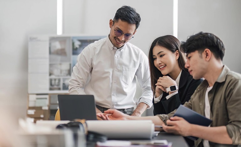 Female engineer on-site  the project in a white hard hat.