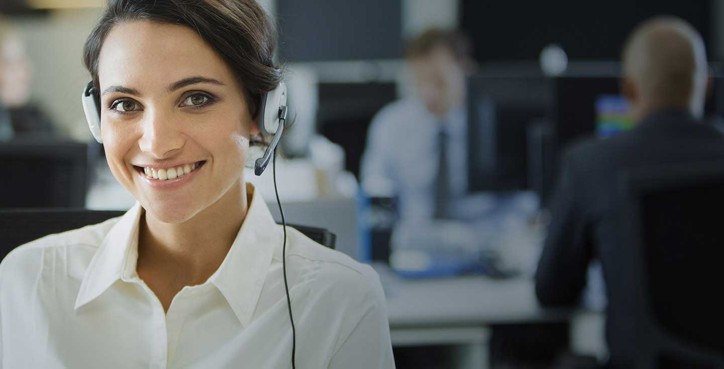 Woman wearing headset in call center