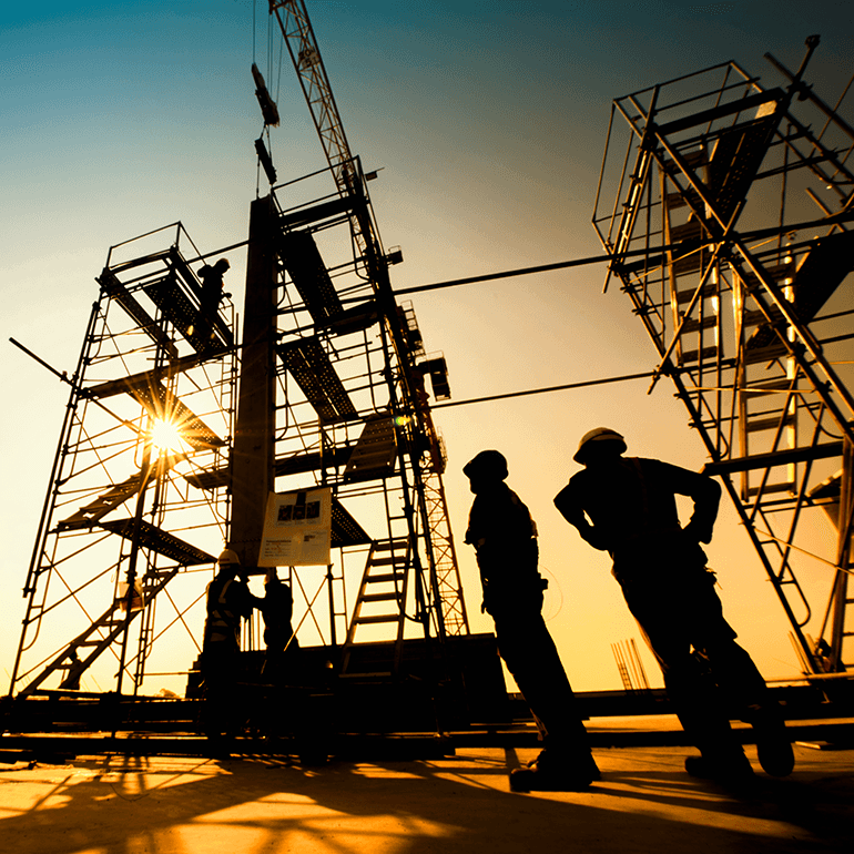 contruction workers next to scaffolding