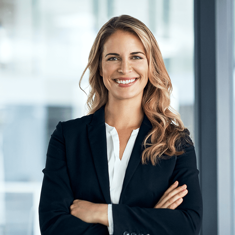woman smiling with arms crossed